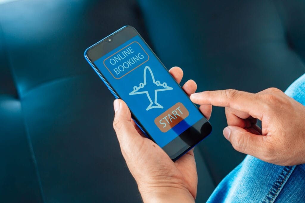 travel trends 2025 Booking flight using mobile phone